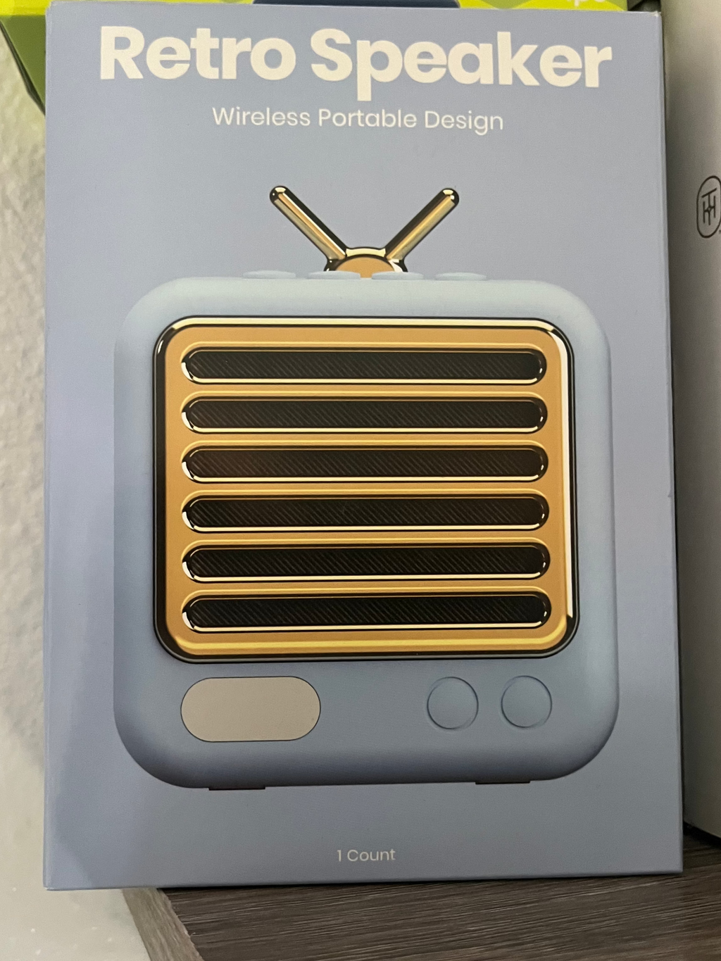 Retro speaker with packaging labeled 'Retro Speaker' on a shelf.