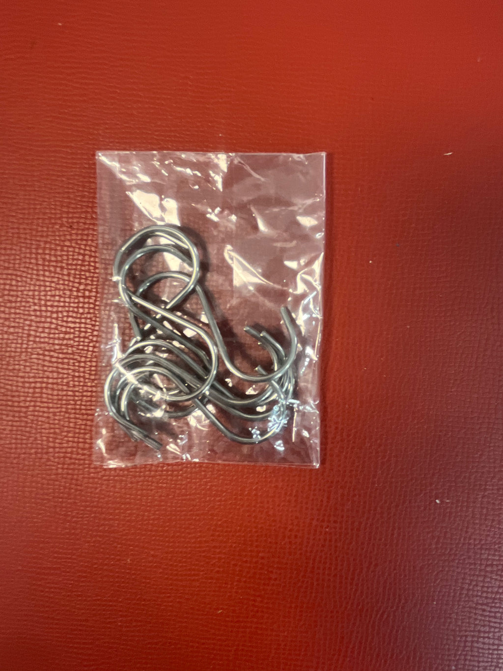 Hooks buckles and fasteners